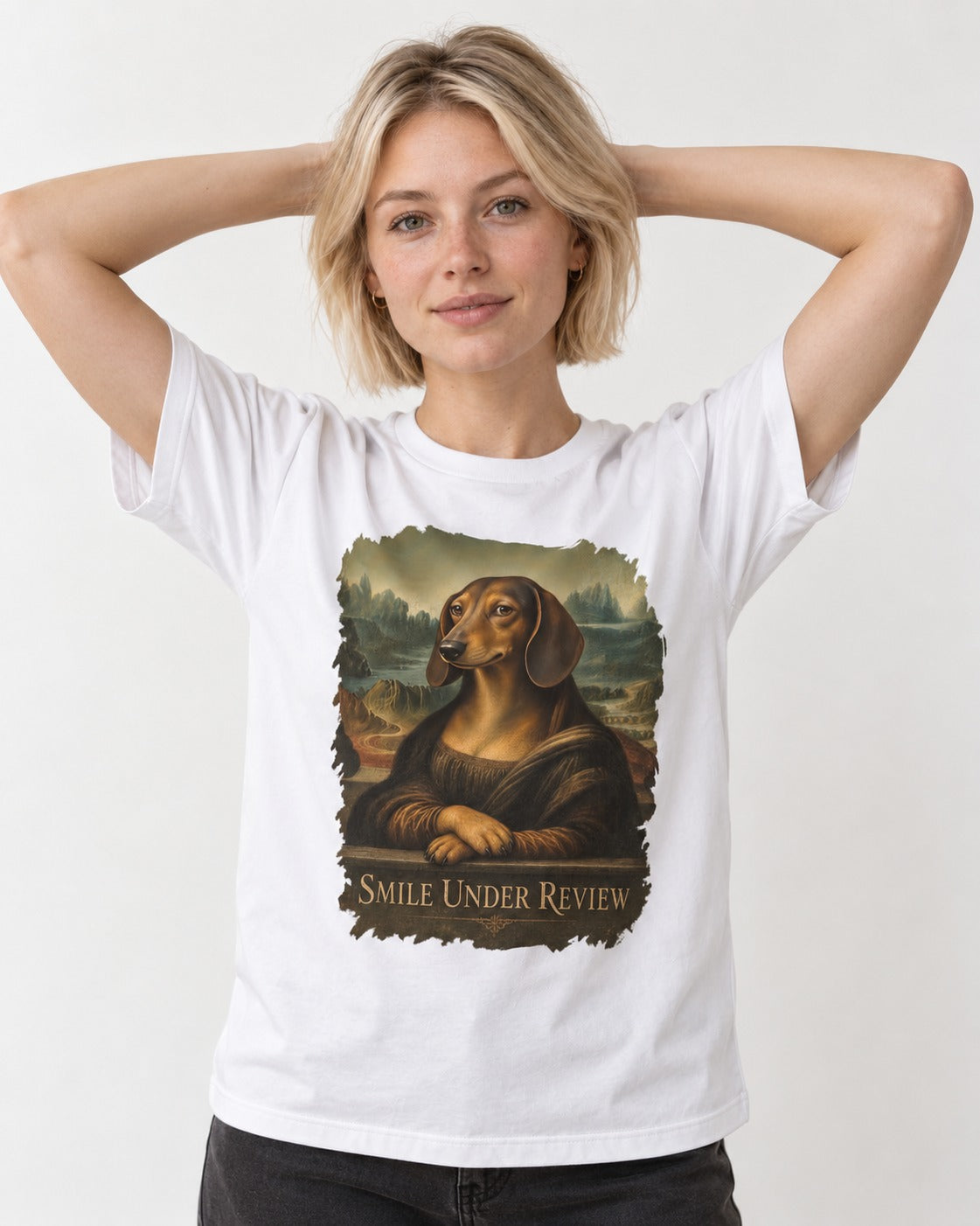 Dachshund Smile Under Review Mona Lisa Graphic T-Shirt in White, worn by a model