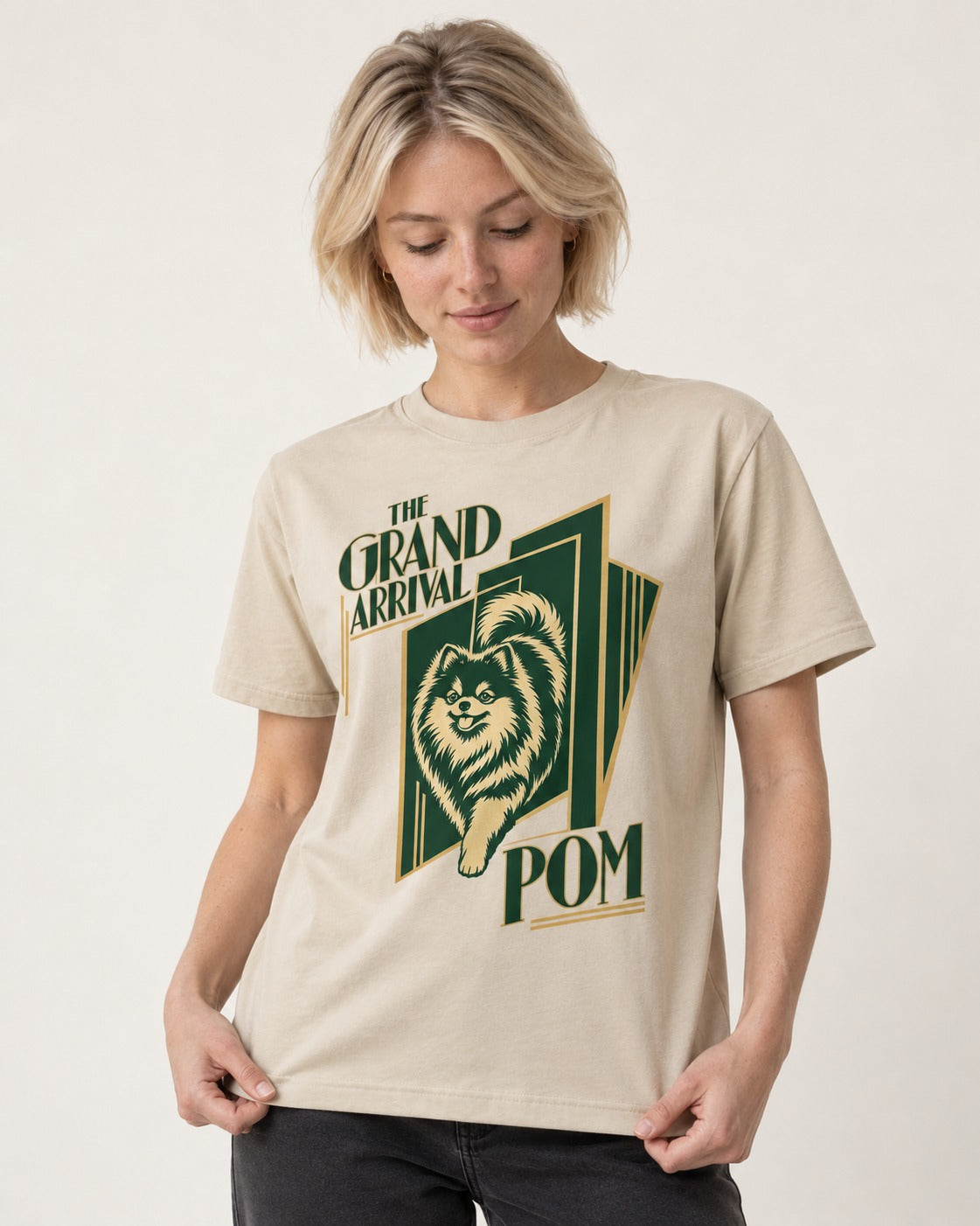 The Grand Arrival Pomeranian T-Shirt in Sand, worn by a model