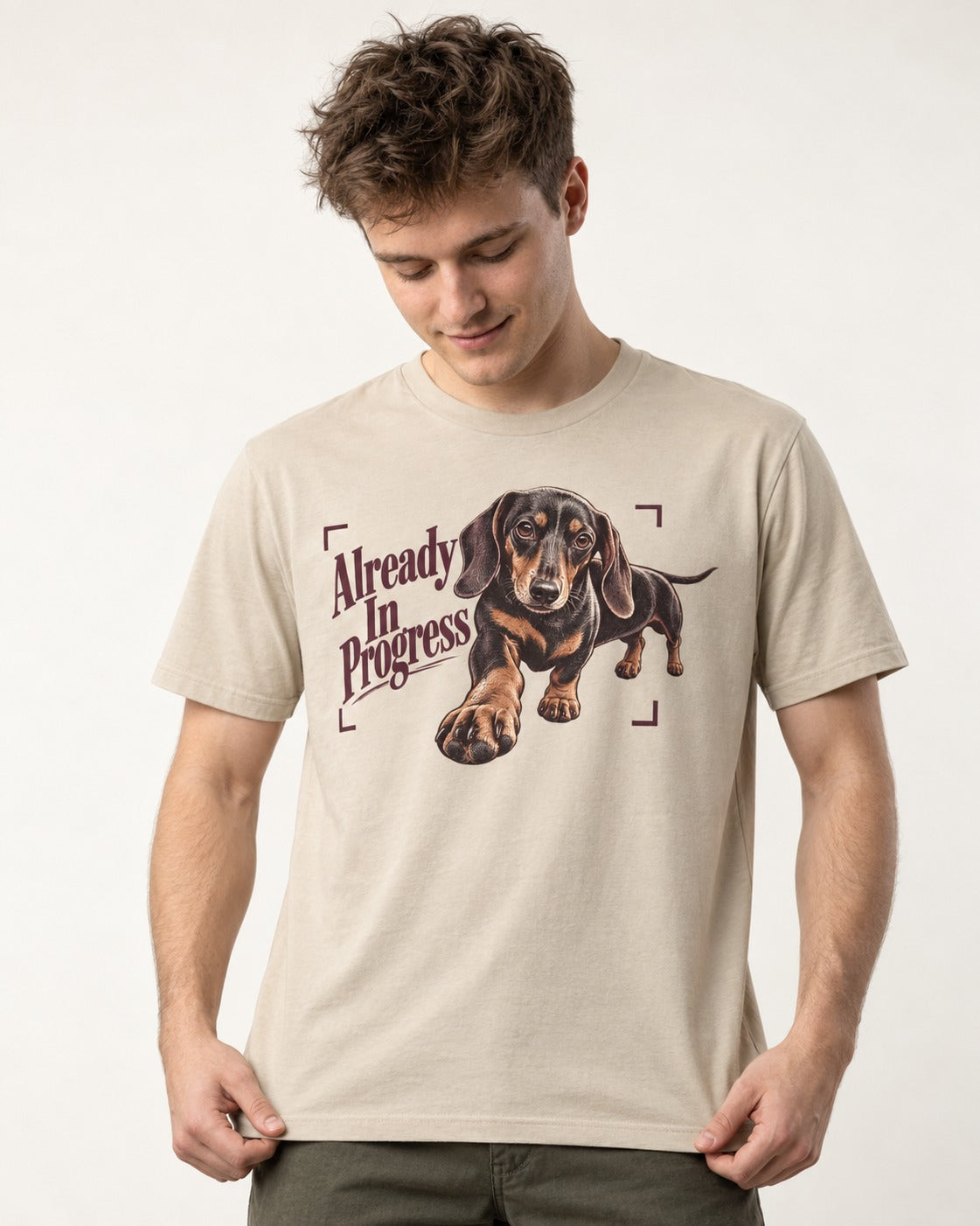 Dachshund Already in Progress T-Shirt in Sand, worn by a model