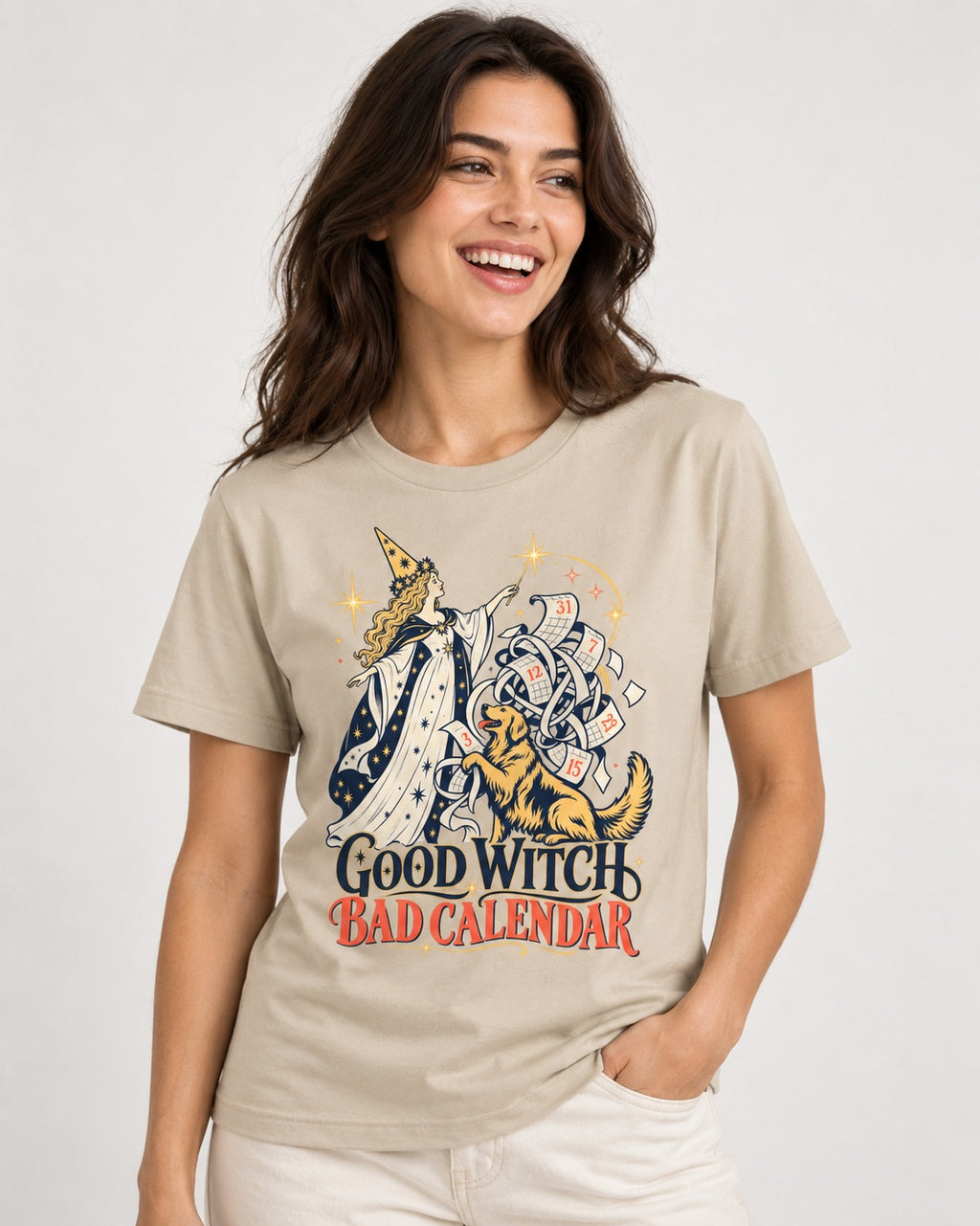 Good Witch Bad Calendar Golden Retriever T-Shirt in Sand, worn by a model