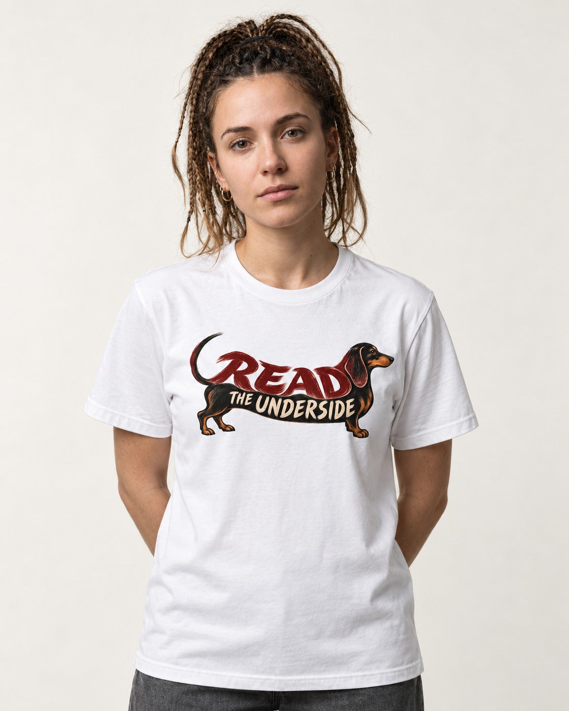 Dachshund Read The Underside Body Lettering Graphic T-Shirt in White, worn by a model