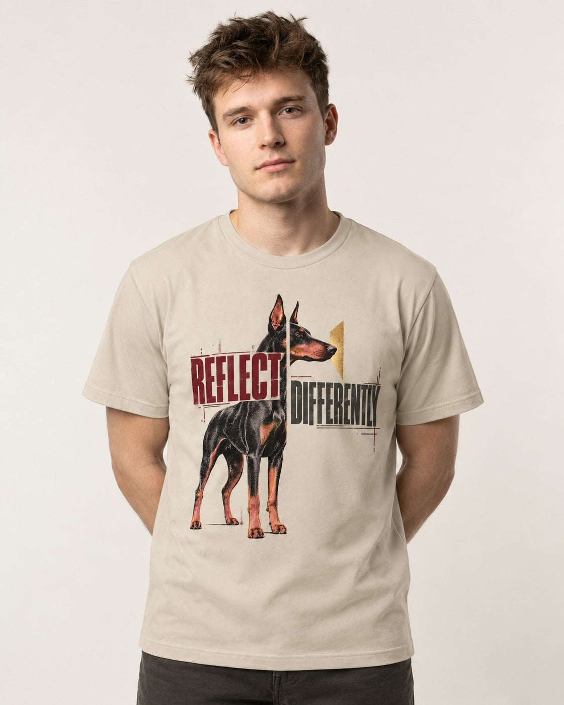 Doberman Reflects Differently T-Shirt in Sand, worn by a model