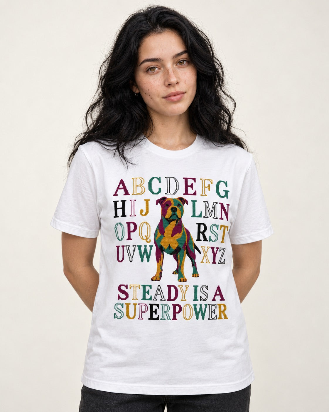 Pitbull Steady Is a Superpower Alphabet Graphic T-Shirt in White, worn by a model