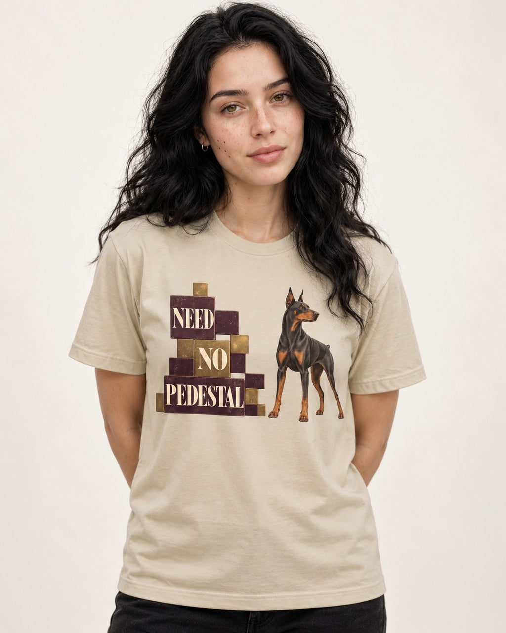Doberman Need No Pedestal T-Shirt in Sand, worn by a model