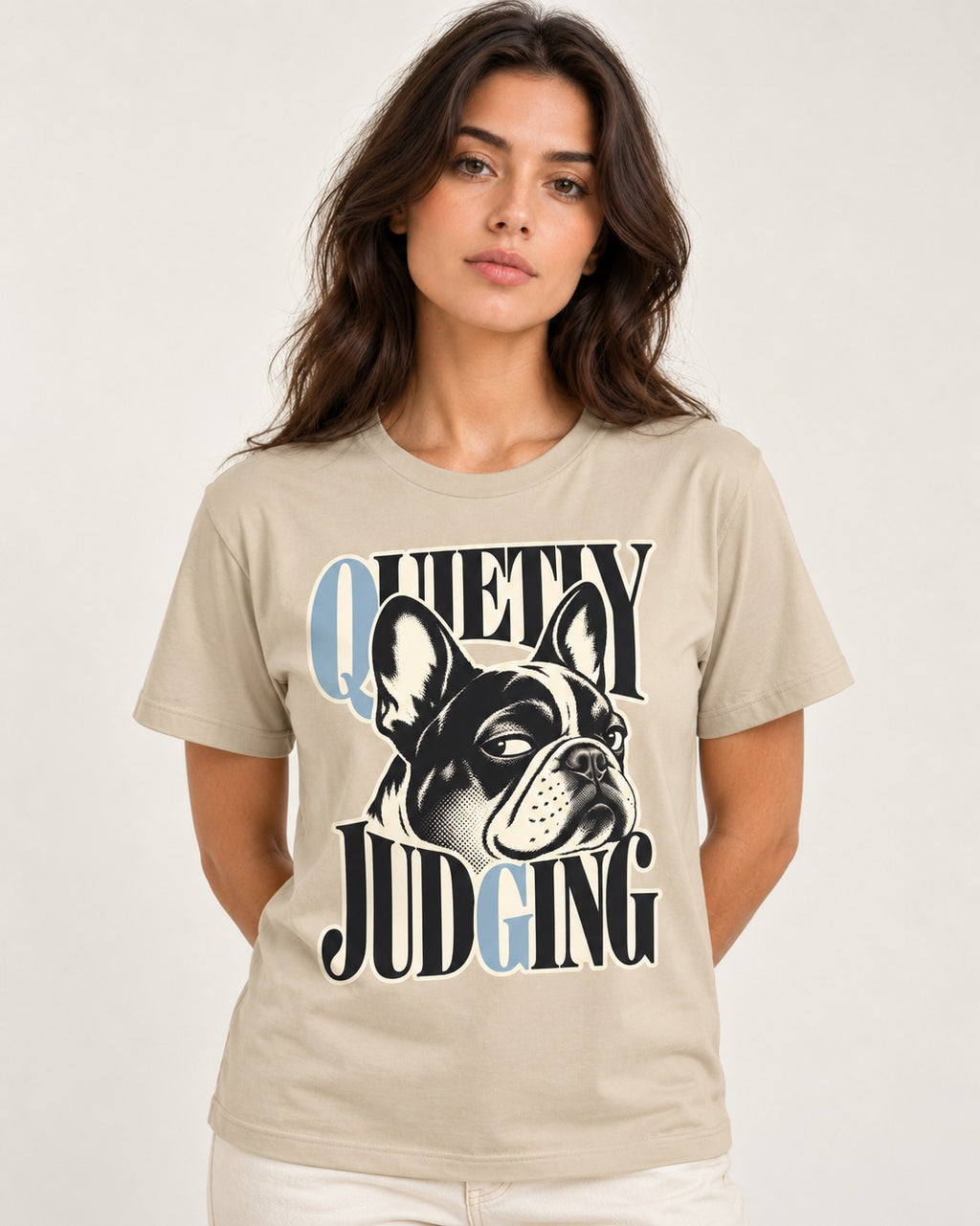 Quietly Judging Frenchie T-Shirt in Sand, worn by a model