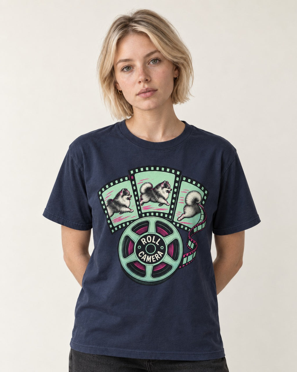 Pomeranian Roll Camera Film Reel Graphic T-Shirt in Navy, worn by a model