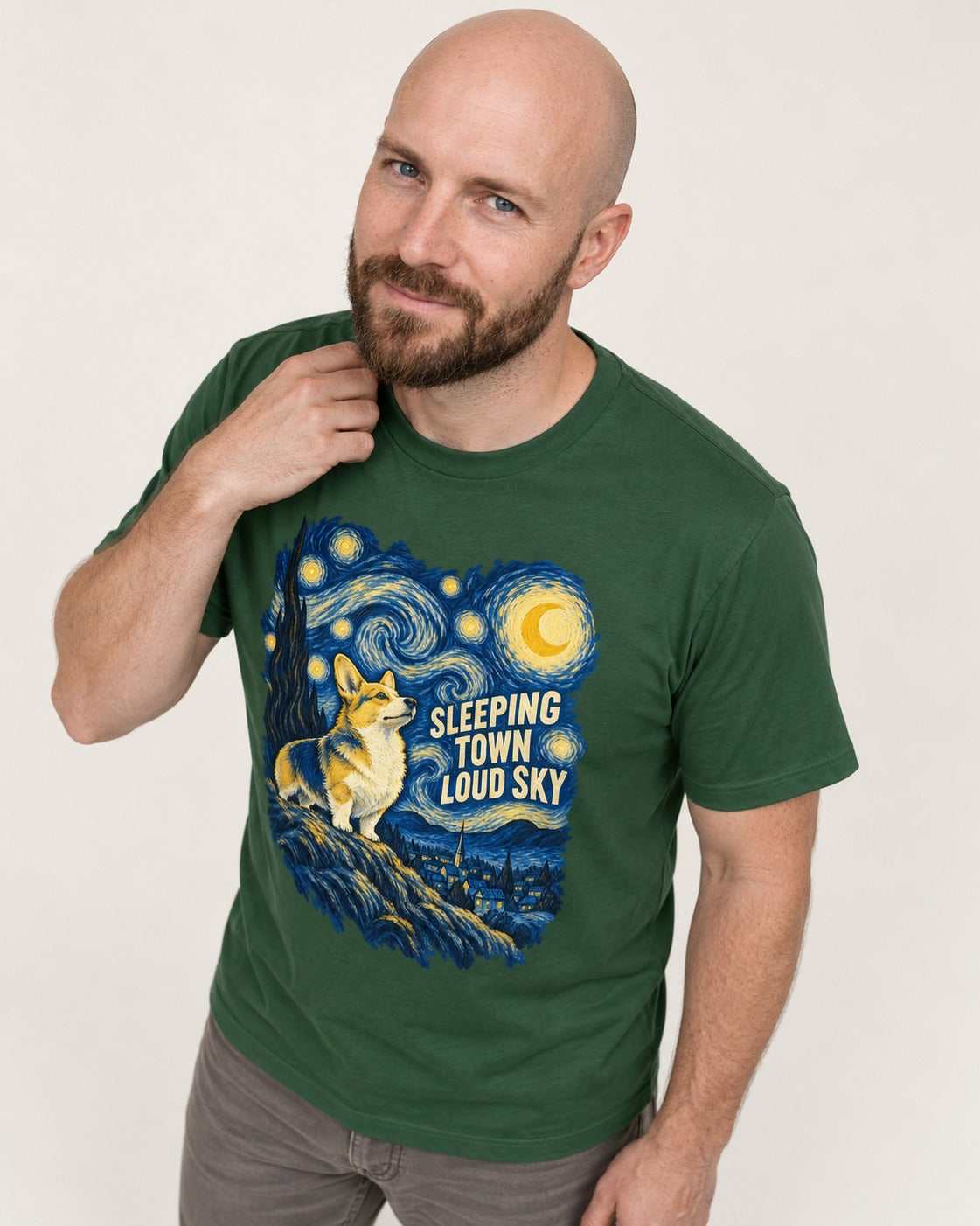 Corgi Sleeping Town Loud Sky Starry Night T-Shirt in Forest Green, worn by a model