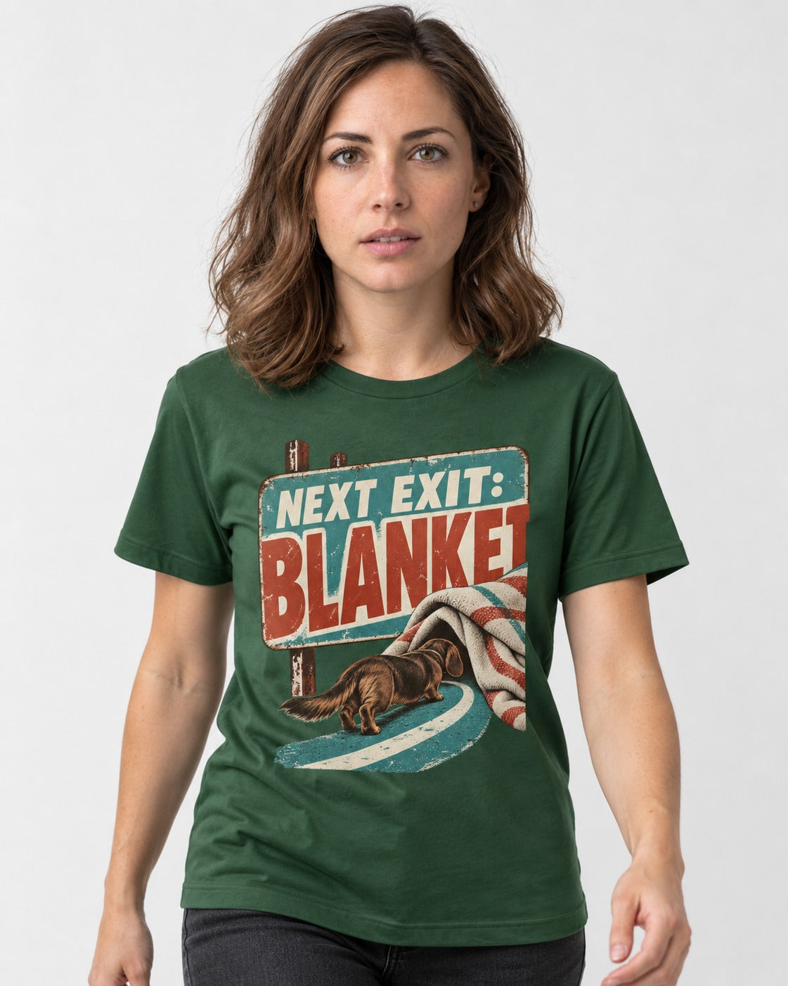 Dachshund Next Exit Blanket Road Sign Graphic T-Shirt in Forest Green, worn by a model