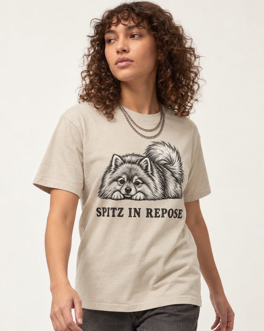 Pomeranian In Repose T-Shirt in Sand, worn by a model