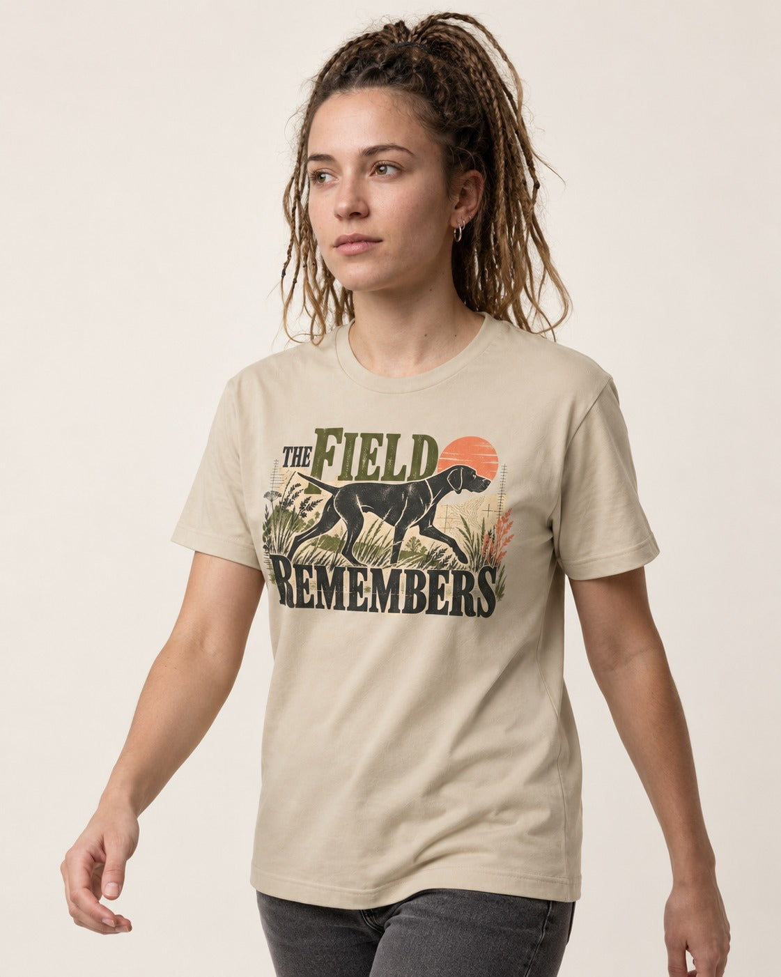The Field Remembers German Shorthaired Pointer T-Shirt in Sand, worn by a model