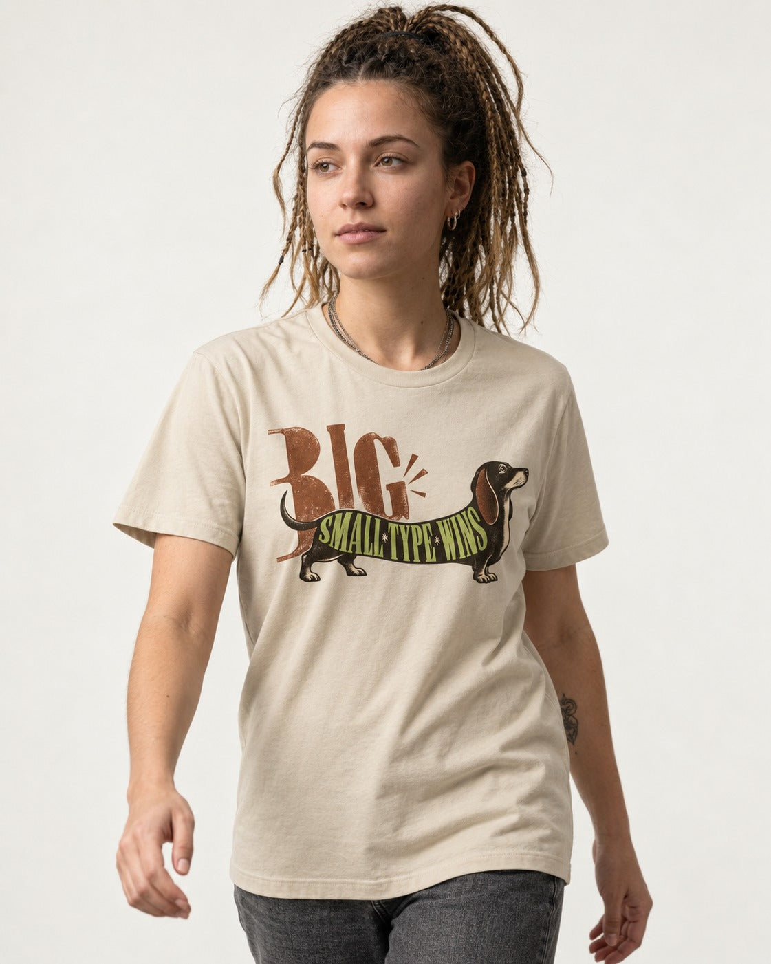 Dachshund Small Type Wins T-Shirt in Sand, worn by a model
