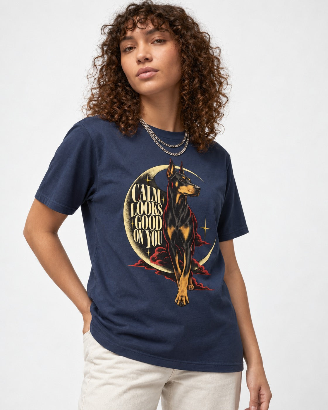 Doberman Calm Looks Good on You Crescent Graphic T-Shirt in Navy, worn by a model