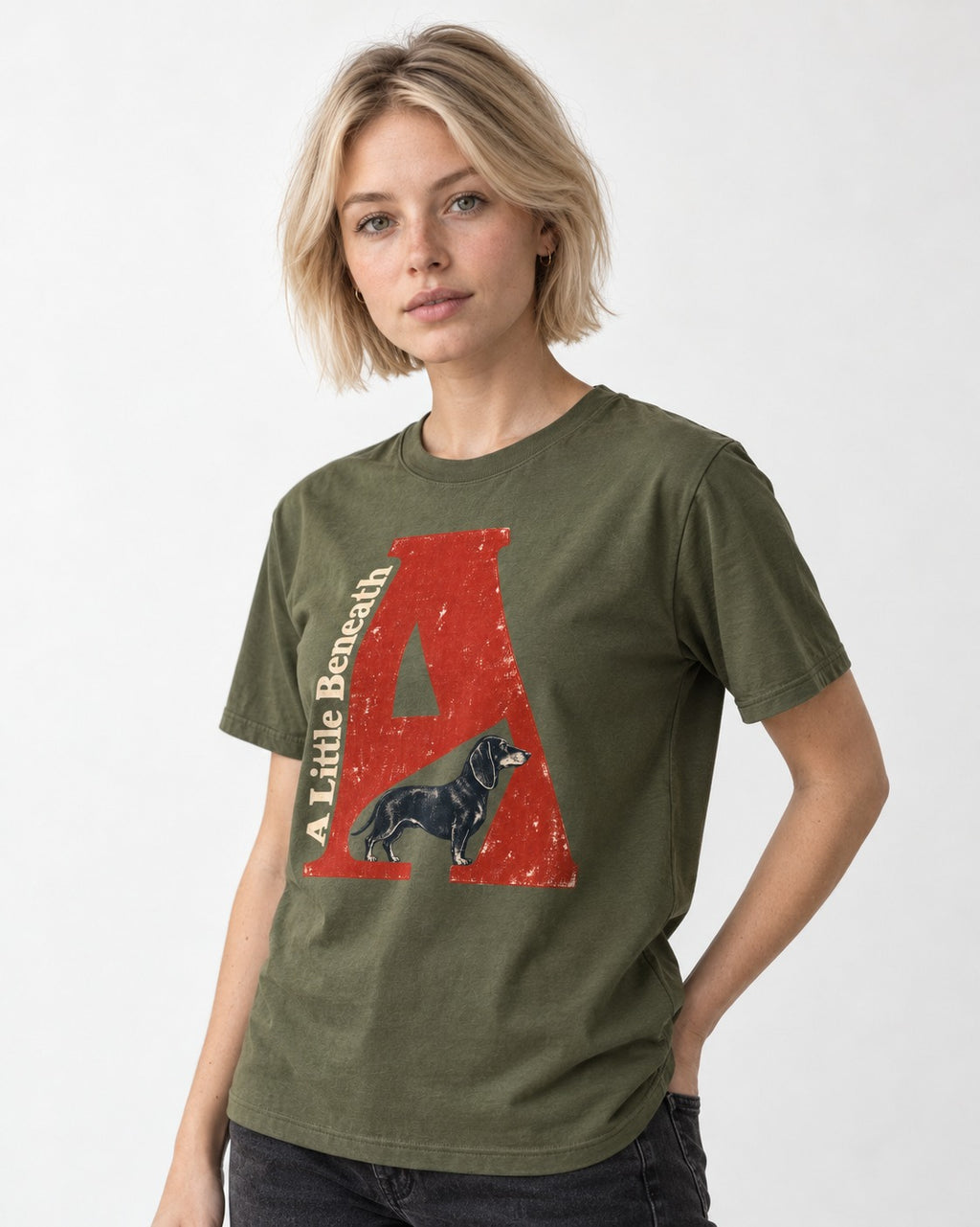 Dachshund A Little Beneath Monumental Letter Graphic T-Shirt in Heather Military Green, worn by a model