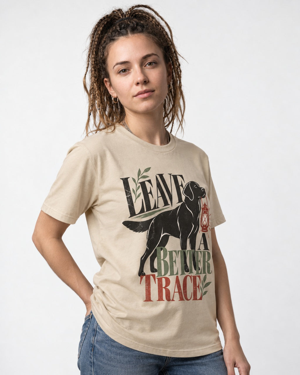 Leave a Better Trace Labrador Retriever T-Shirt in Sand, worn by a model