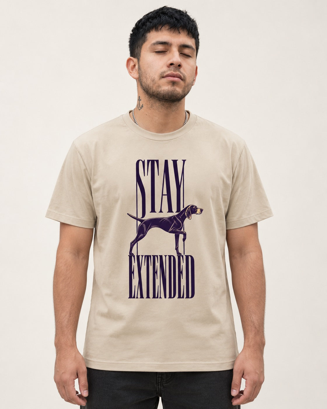 Stay Extended German Shorthaired Pointer T-Shirt in Sand, worn by a model