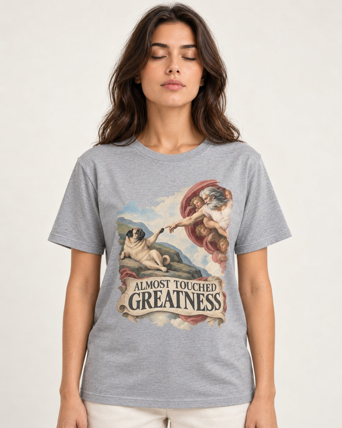 Pug Almost Touched Greatness Creation Parody Graphic T-Shirt in Sport Grey, worn by a model