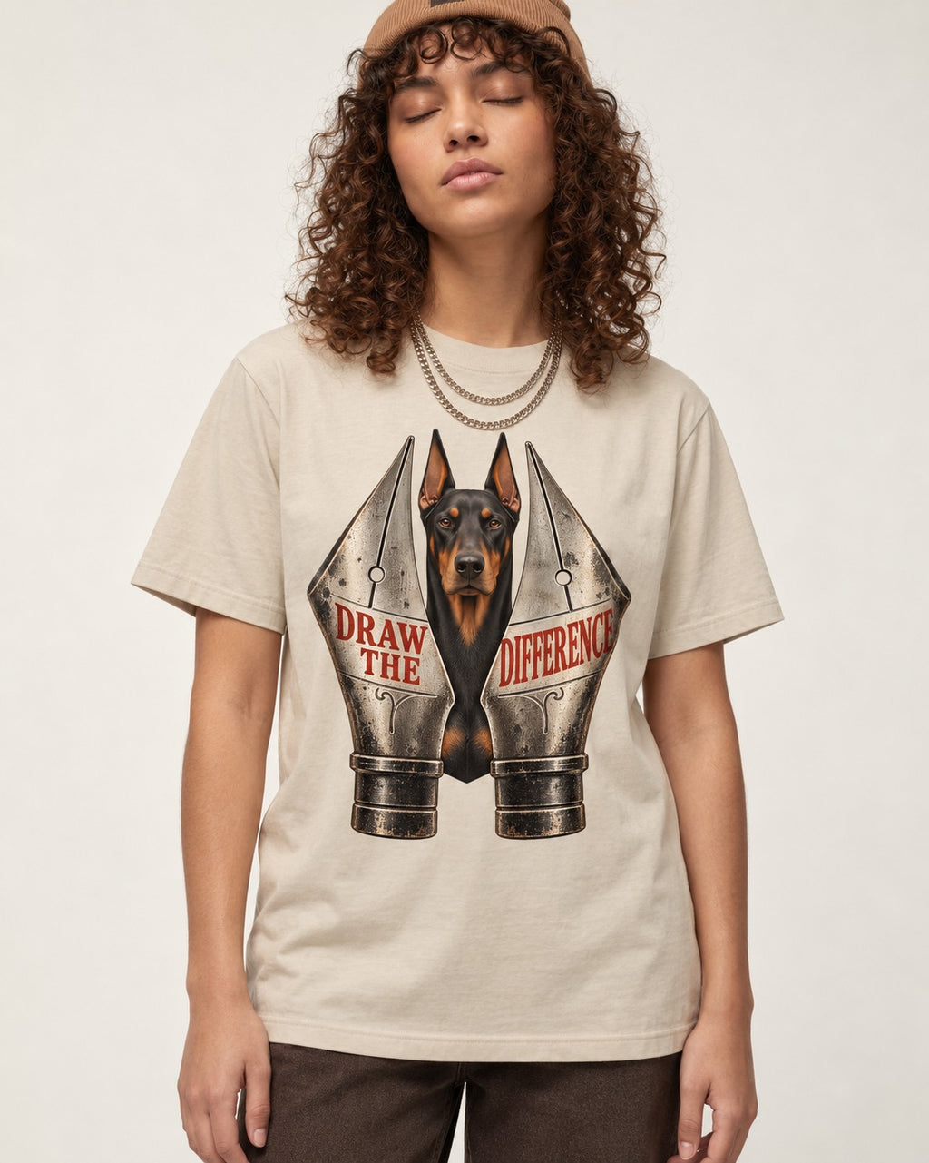 Doberman Draw the Difference T-Shirt in Sand, worn by a model