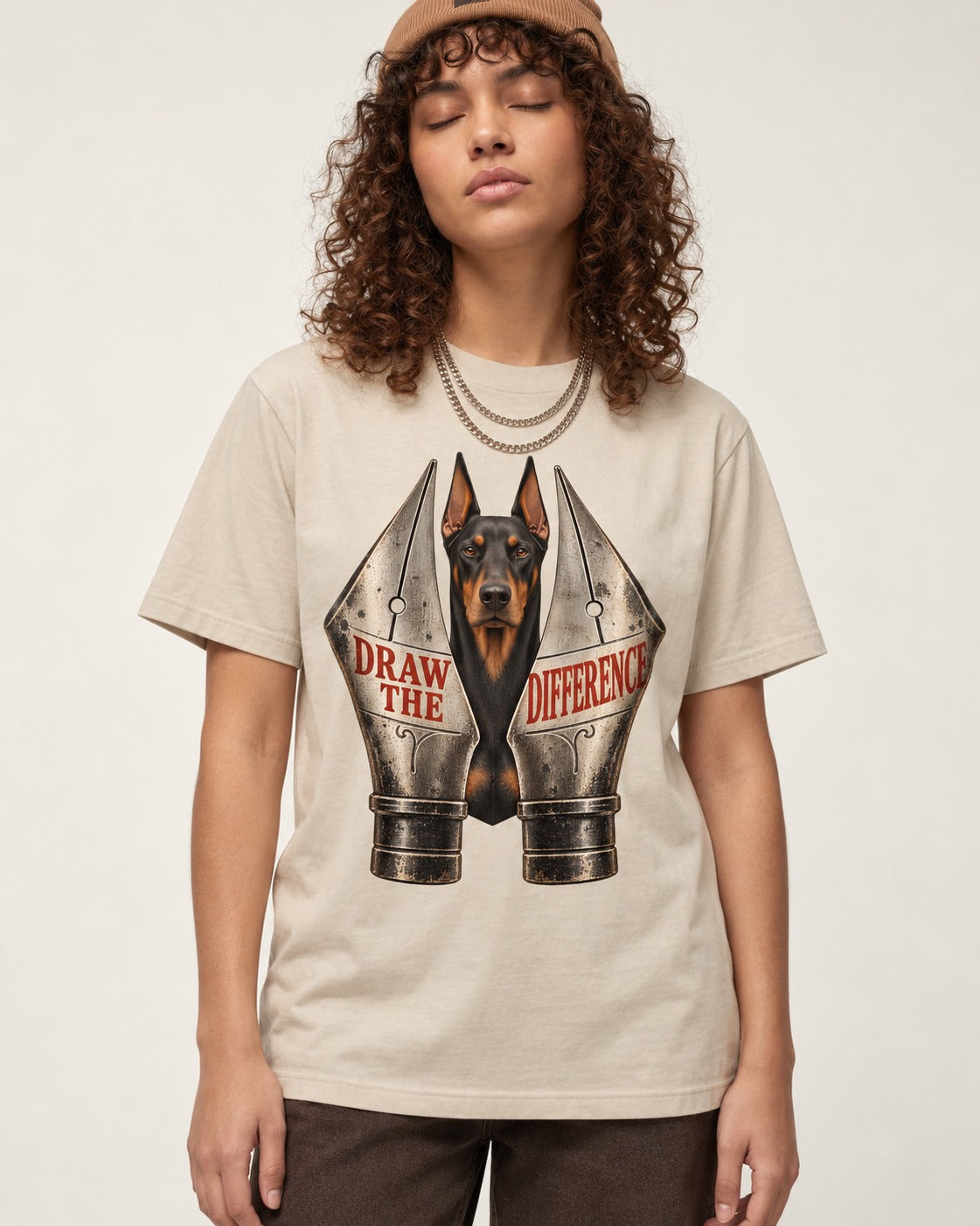 Doberman Draw the Difference T-Shirt in Sand, worn by a model
