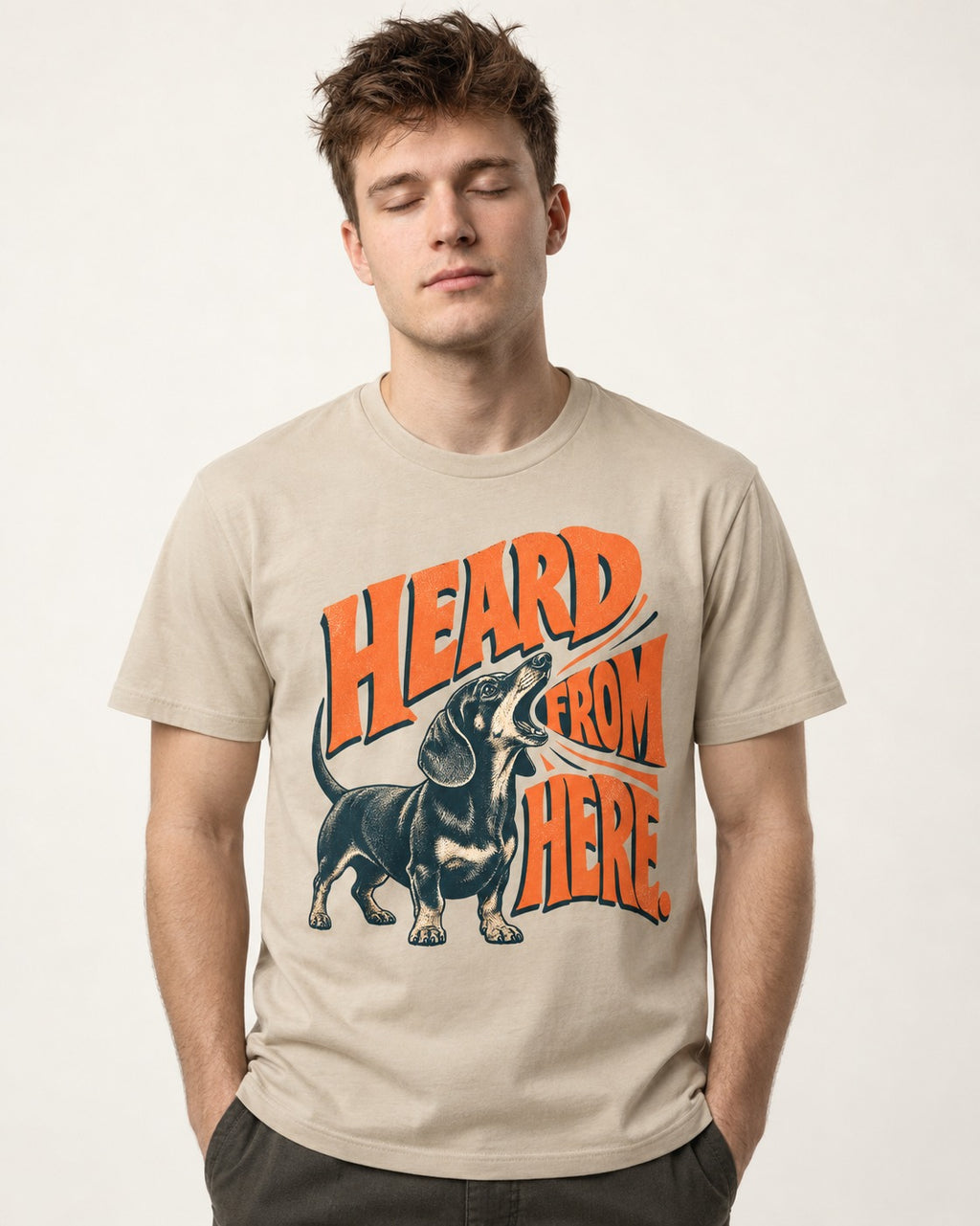 Dachshund Heard From Here T-Shirt in Sand, worn by a model
