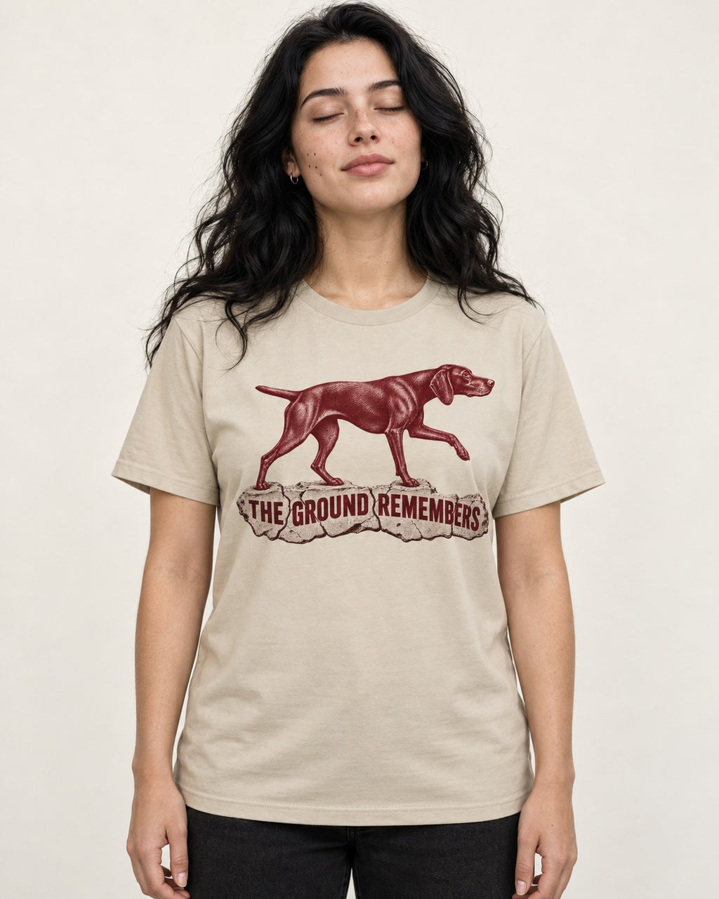 The Ground Remembers German Shorthaired Pointer T-Shirt in Sand, worn by a model