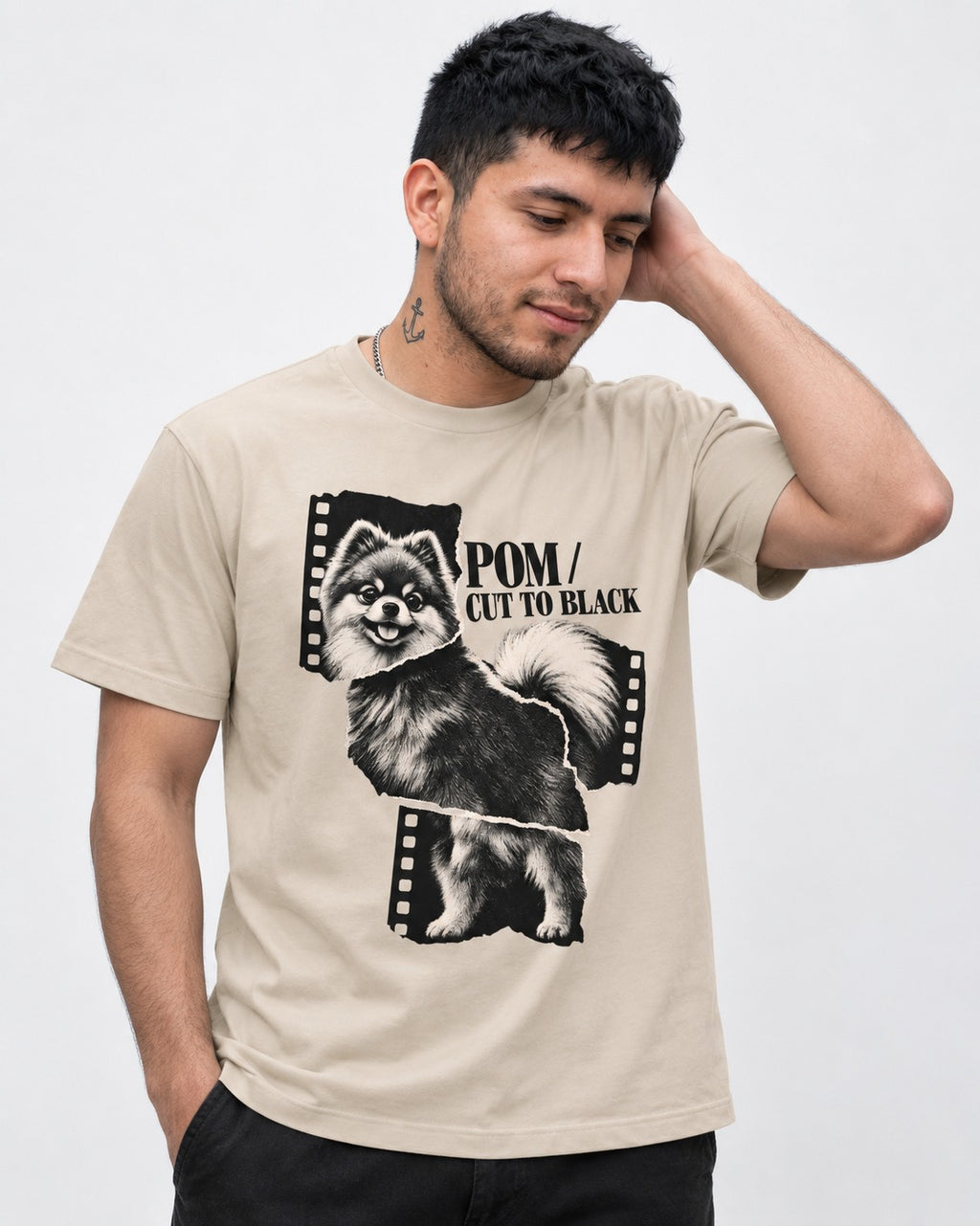 Pomeranian Cut to Black T-Shirt in Sand, worn by a model