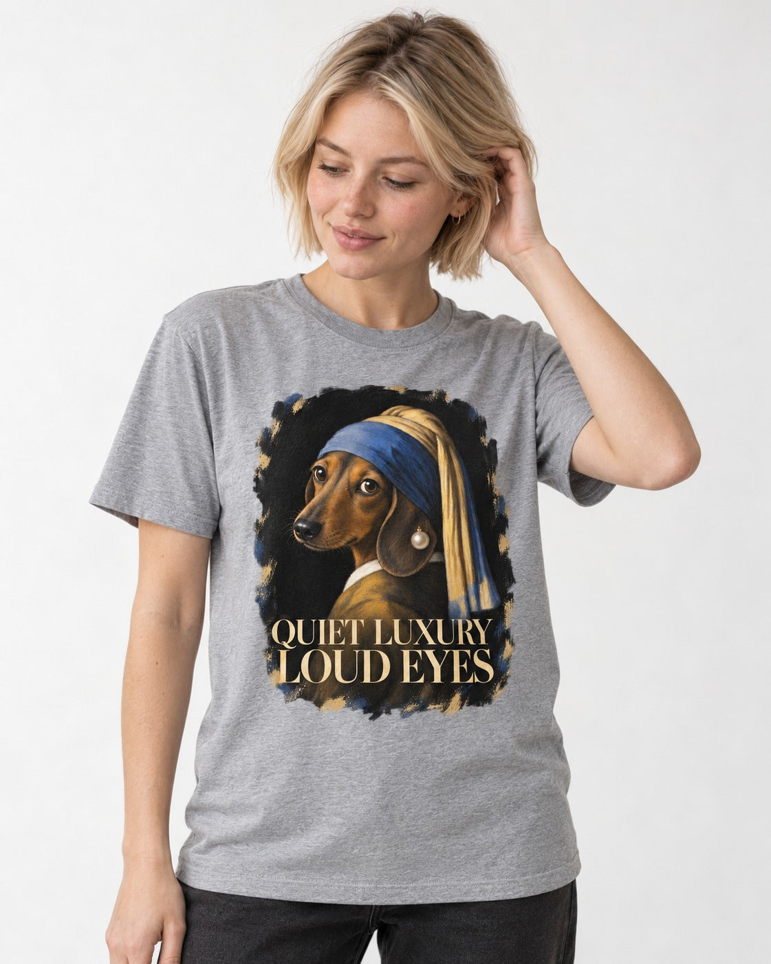 Dachshund Quiet Luxury Loud Eyes Pearl Portrait Graphic T-Shirt in Sport Grey, worn by a model