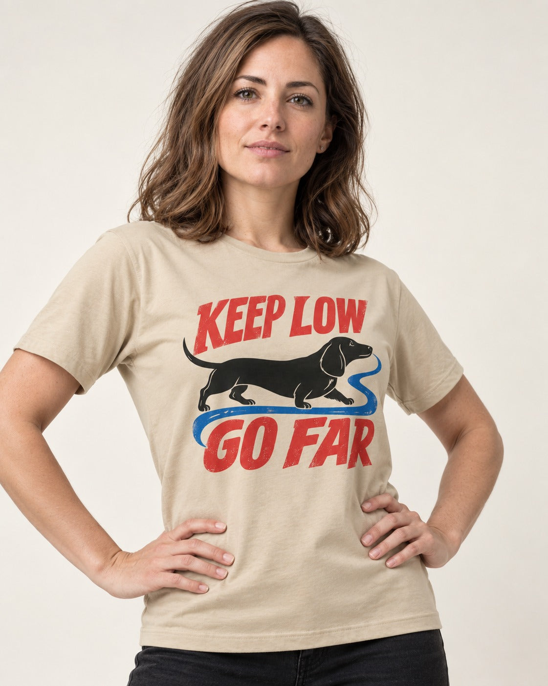 Keep Low Go Far Dachshund T-Shirt in Sand, worn by a model