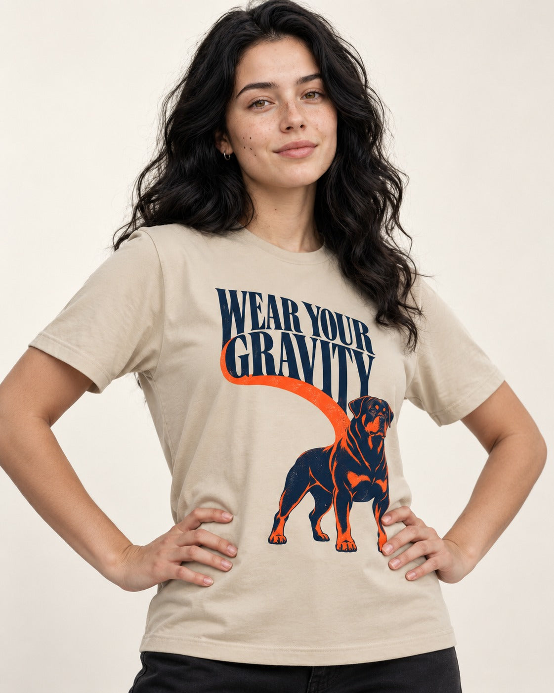 Wear Your Gravity Rottweiler T-Shirt in Sand, worn by a model