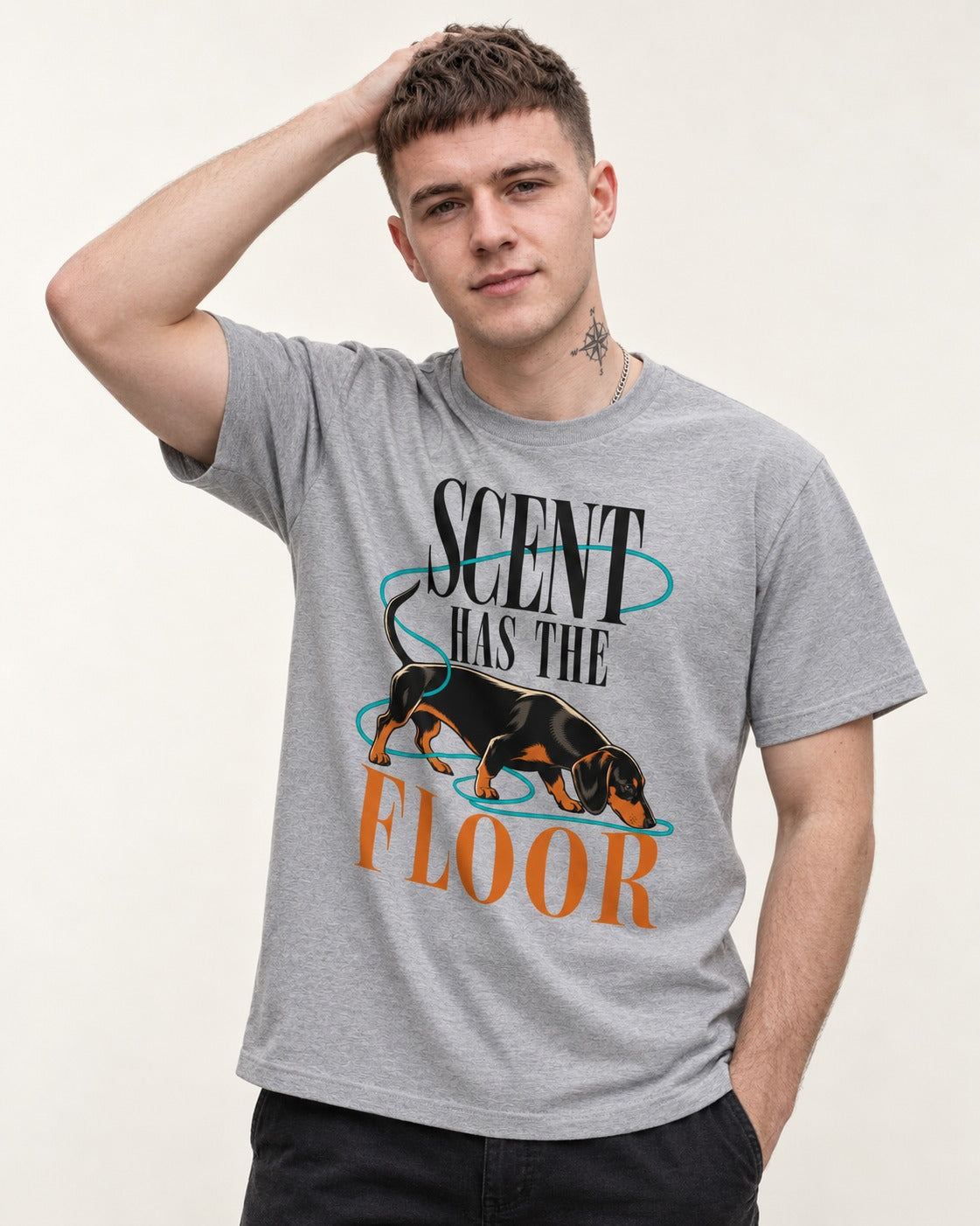 Dachshund Scent Has the Floor T-Shirt in Sport Grey, worn by a model