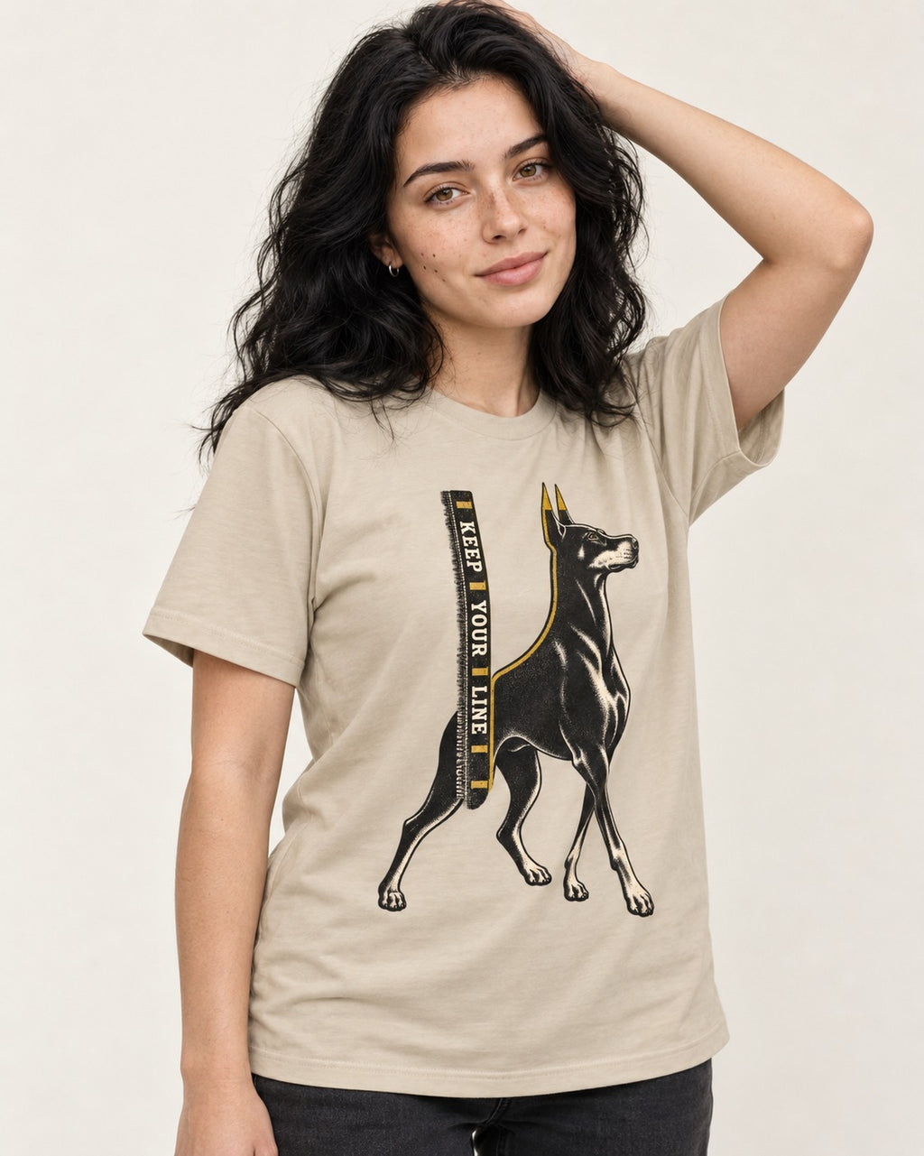 Keep Your Line Doberman T-Shirt in Sand, worn by a model