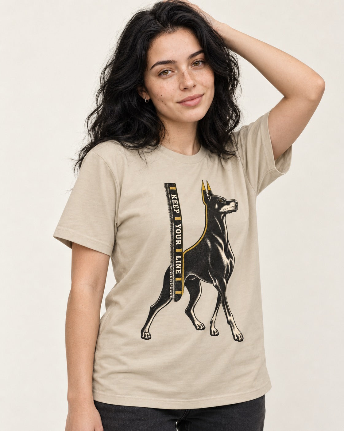 Keep Your Line Doberman T-Shirt in Sand, worn by a model