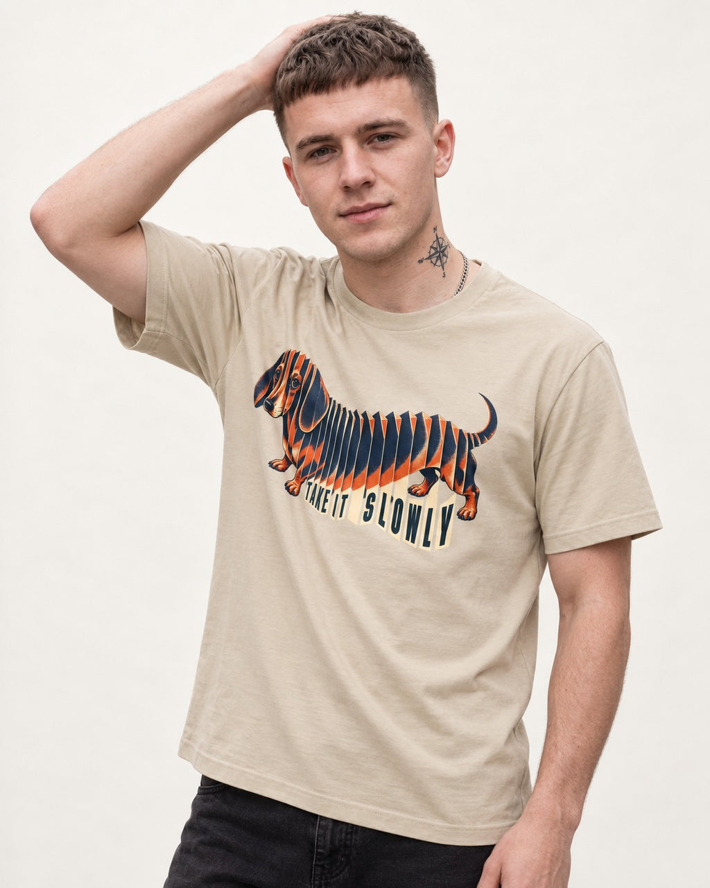 Take It Slowly Dachshund T-Shirt in Sand, worn by a model