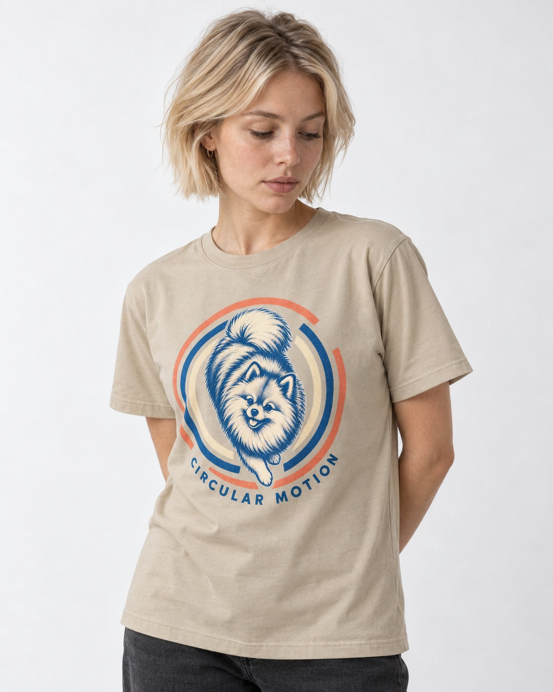 Pomeranian Circular Motion T-Shirt in Sand, worn by a model