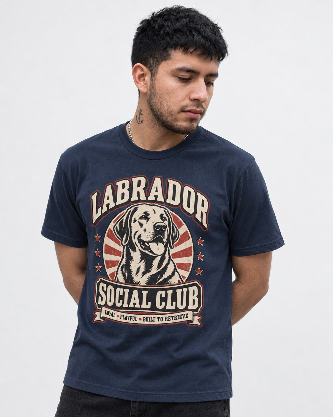 Labrador Retriever Social Club Loyal Playful Built to Retrieve Badge Graphic T-Shirt in Navy, worn by a model