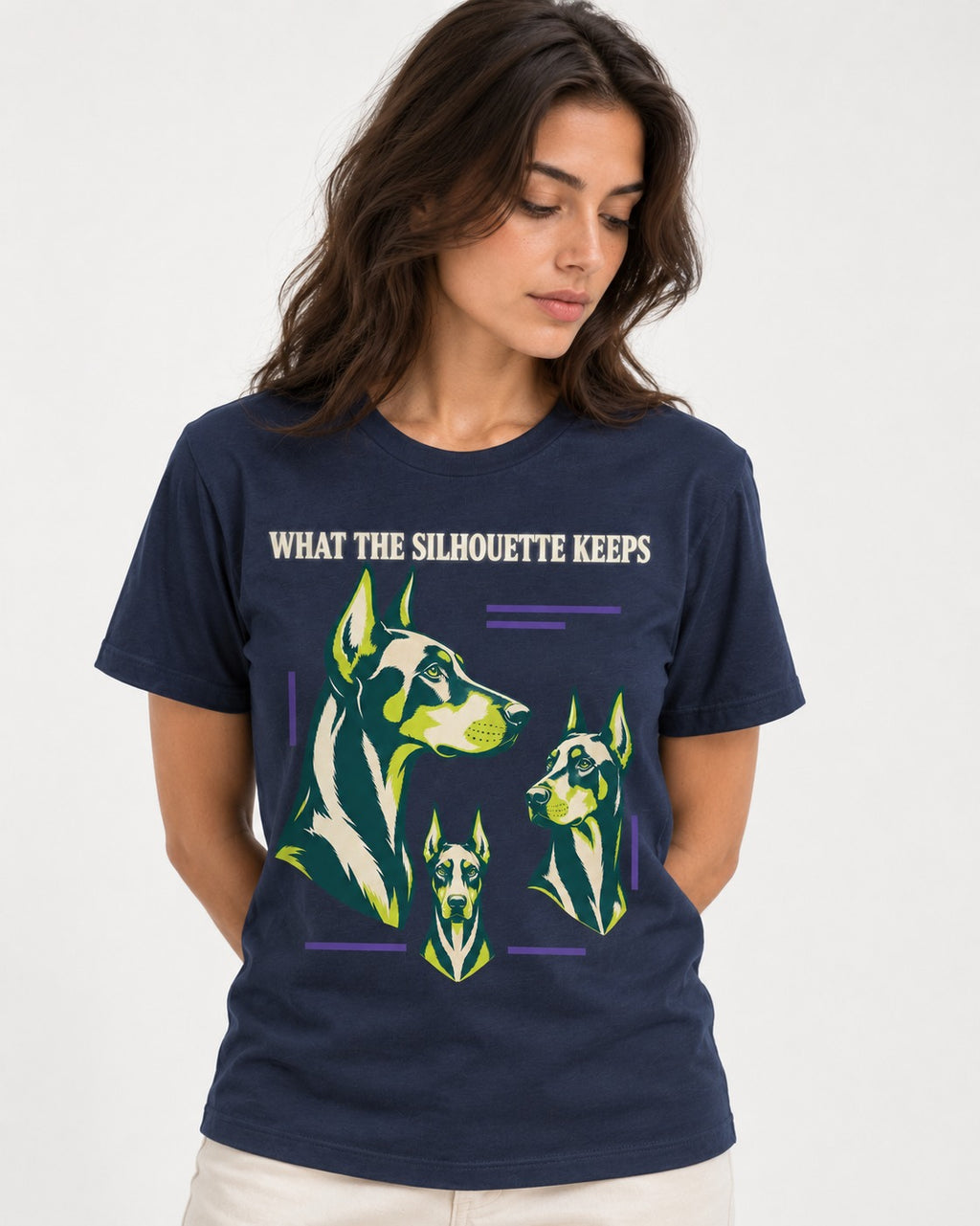 Doberman What the Silhouette Keeps Three Portrait Graphic T-Shirt in Navy, worn by a model