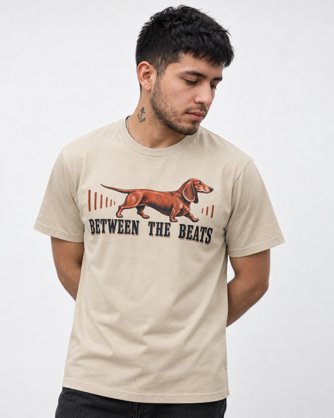 Dachshund Between the Beats T-Shirt in Sand, worn by a model