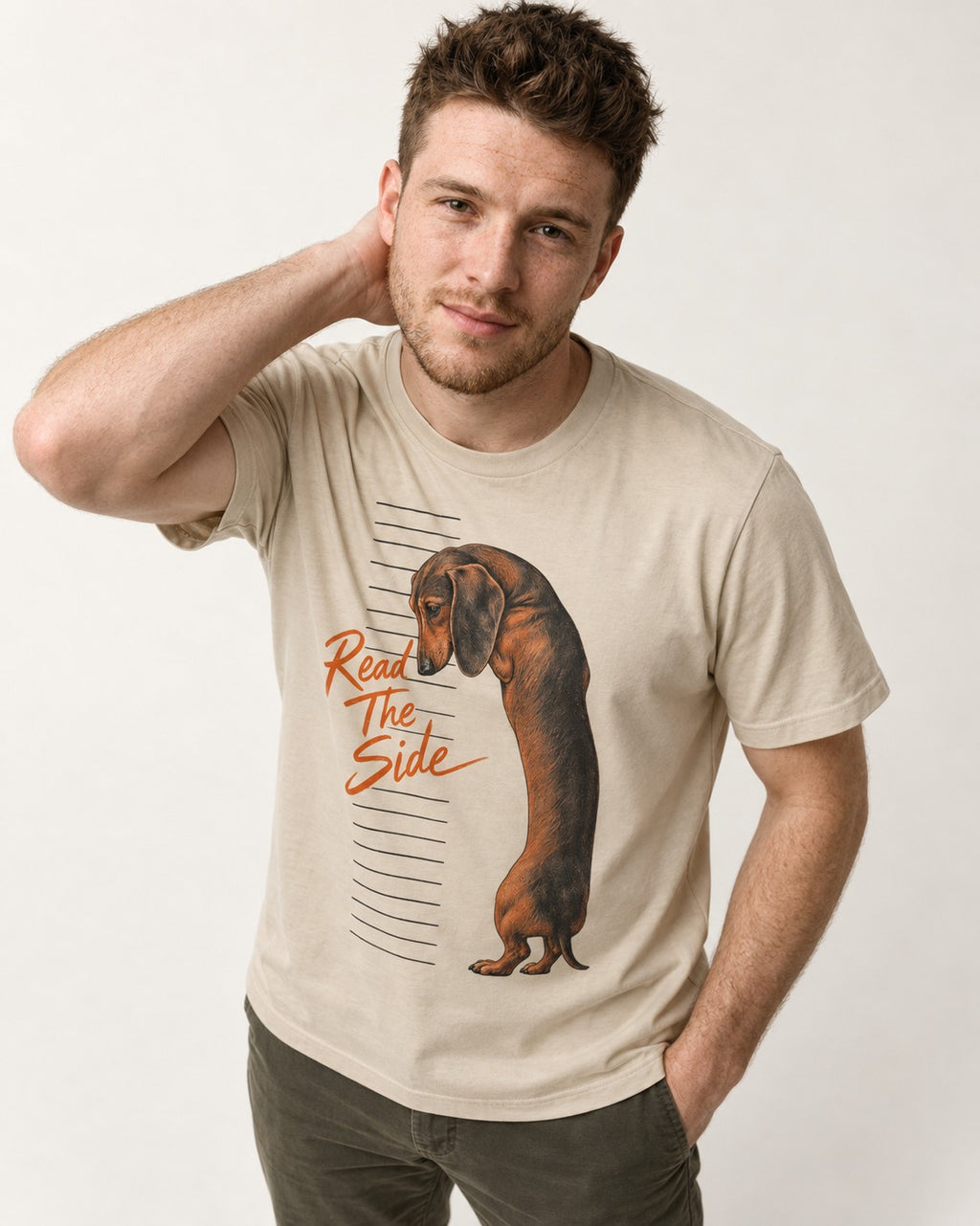 Dachshund Read The Side Measurement Graphic T-Shirt in Sand, worn by a model