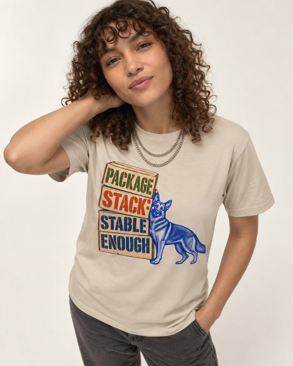 Package Stack Stable Enough German Shepherd Dog T-Shirt in Sand, worn by a model