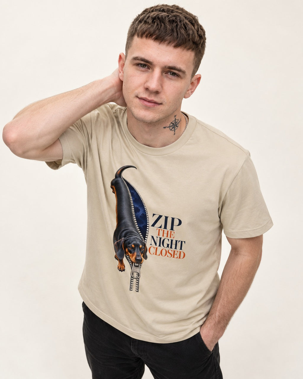 Zip the Night Closed Dachshund T-Shirt in Sand, worn by a model