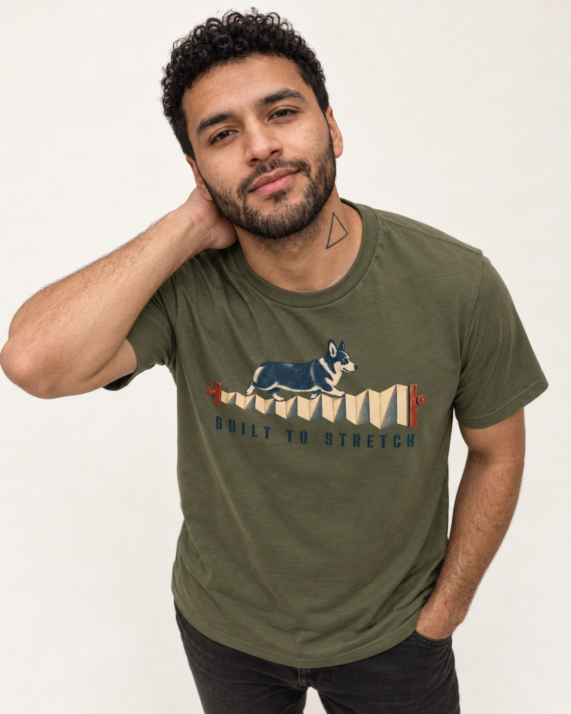 Corgi Built to Stretch Accordion Graphic T-Shirt in Heather Military Green, worn by a model