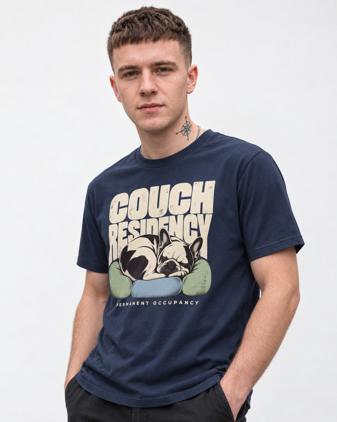Frenchie Couch Residency Permanent Occupancy Cushion Graphic T-Shirt in Navy, worn by a model