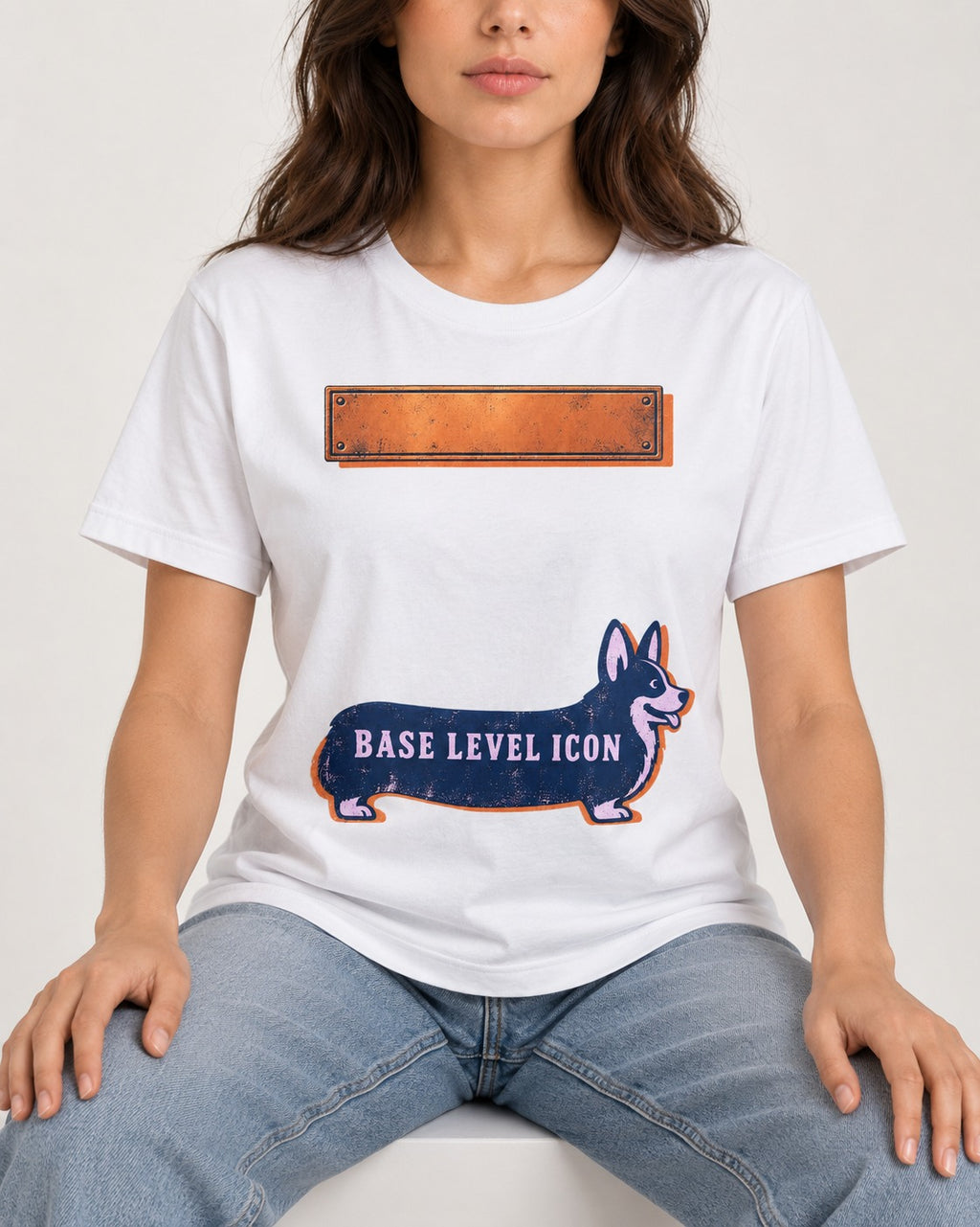 Corgi Base Level Icon Graphic T-Shirt in White, worn by a seated model