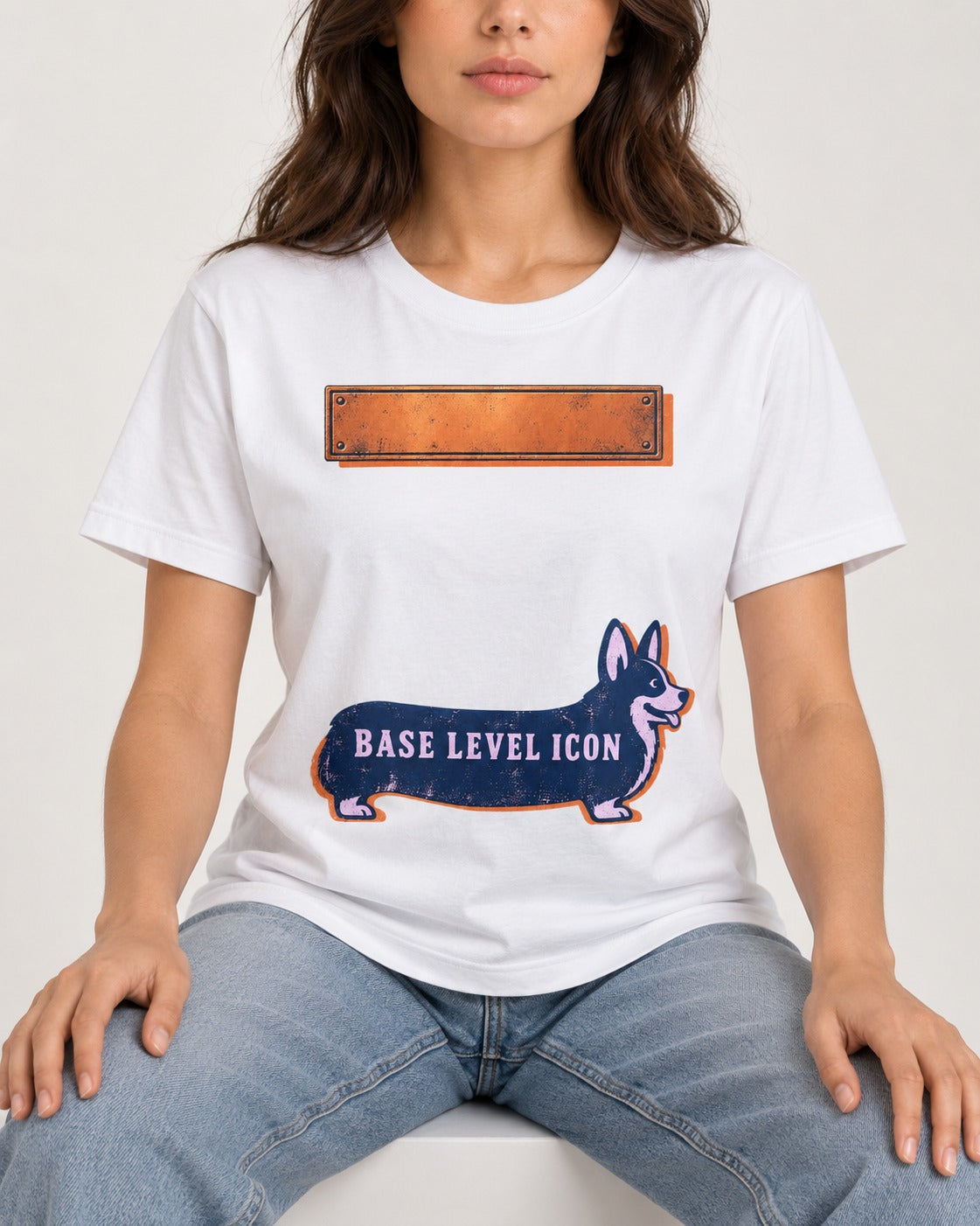 Corgi Base Level Icon Graphic T-Shirt in White, worn by a seated model