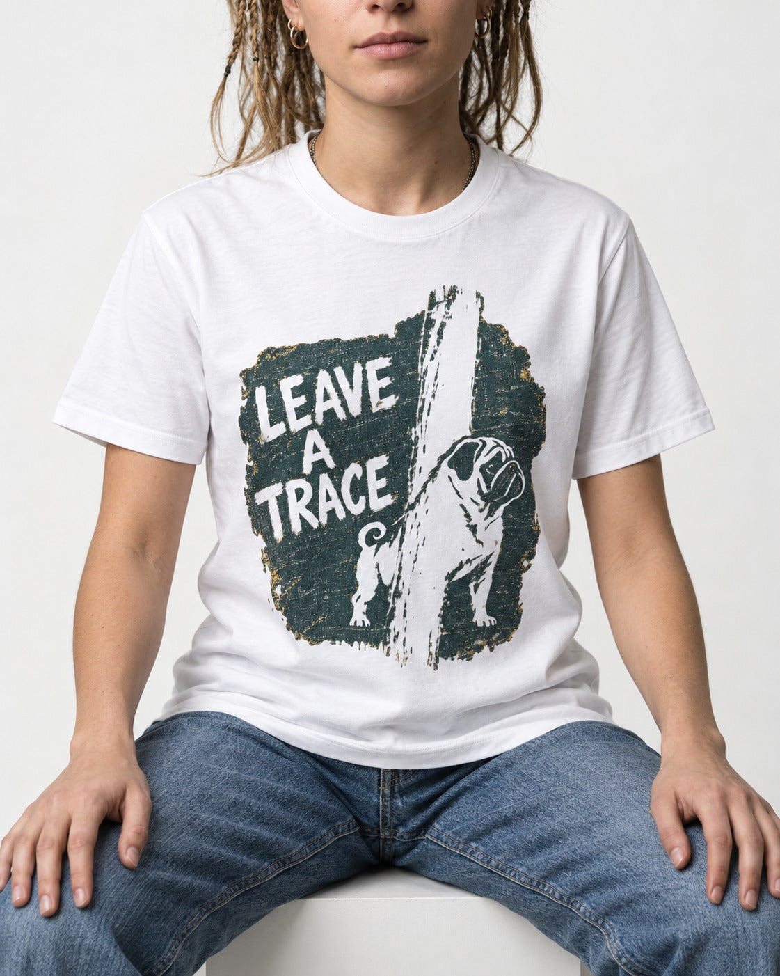 Pug Leaves a Trace T-Shirt in White, worn by a seated model