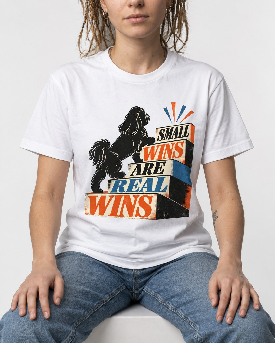 Small Wins Shih Tzu T-Shirt in White, worn by a seated model