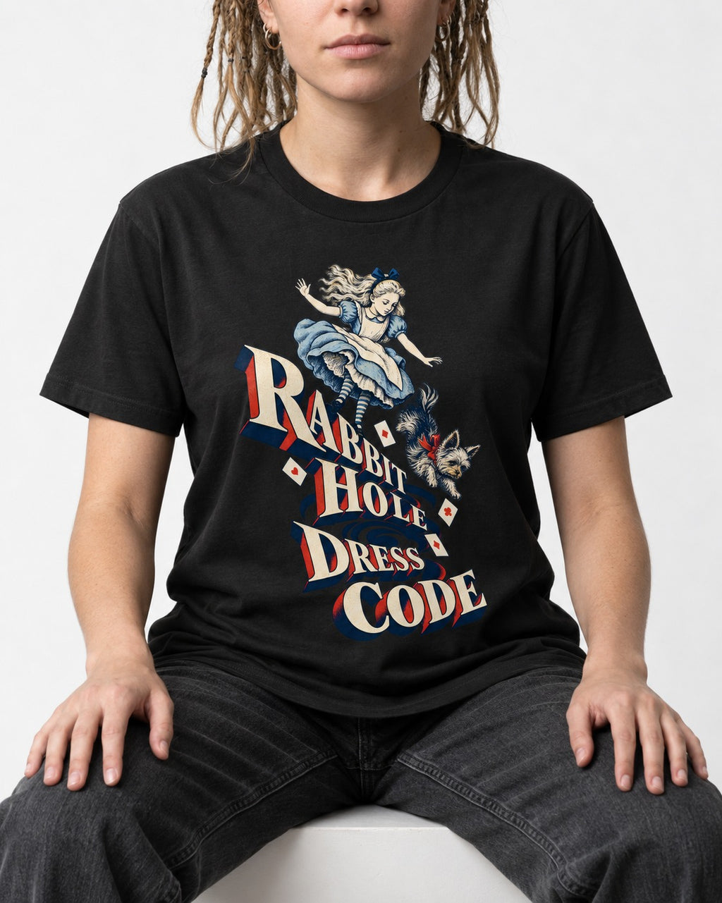 Yorkshire Terrier Rabbit Hole Dress Code Wonderland Graphic T-Shirt in Black, worn by a seated model