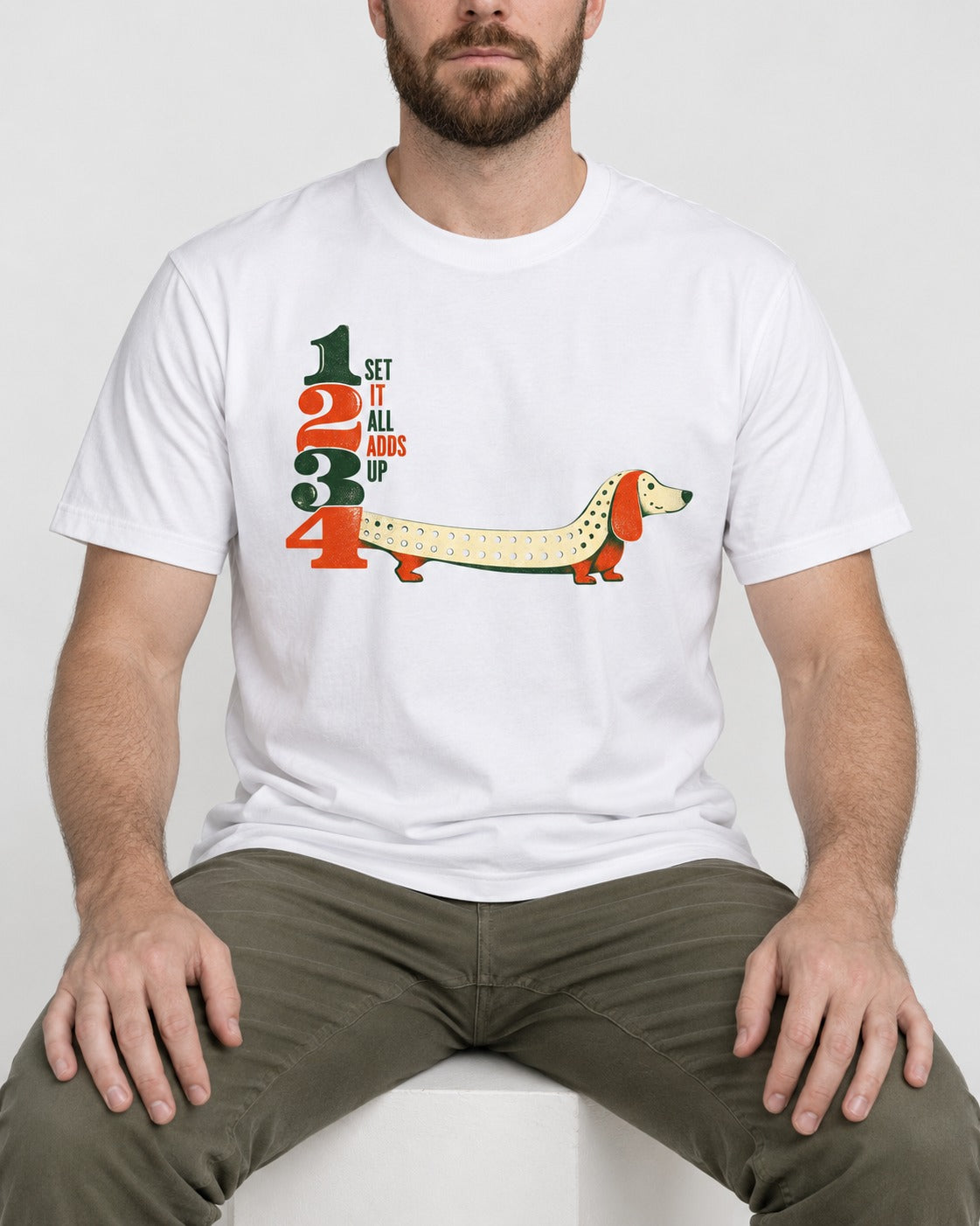 Dachshund Adds Up T-Shirt in White, worn by a seated model