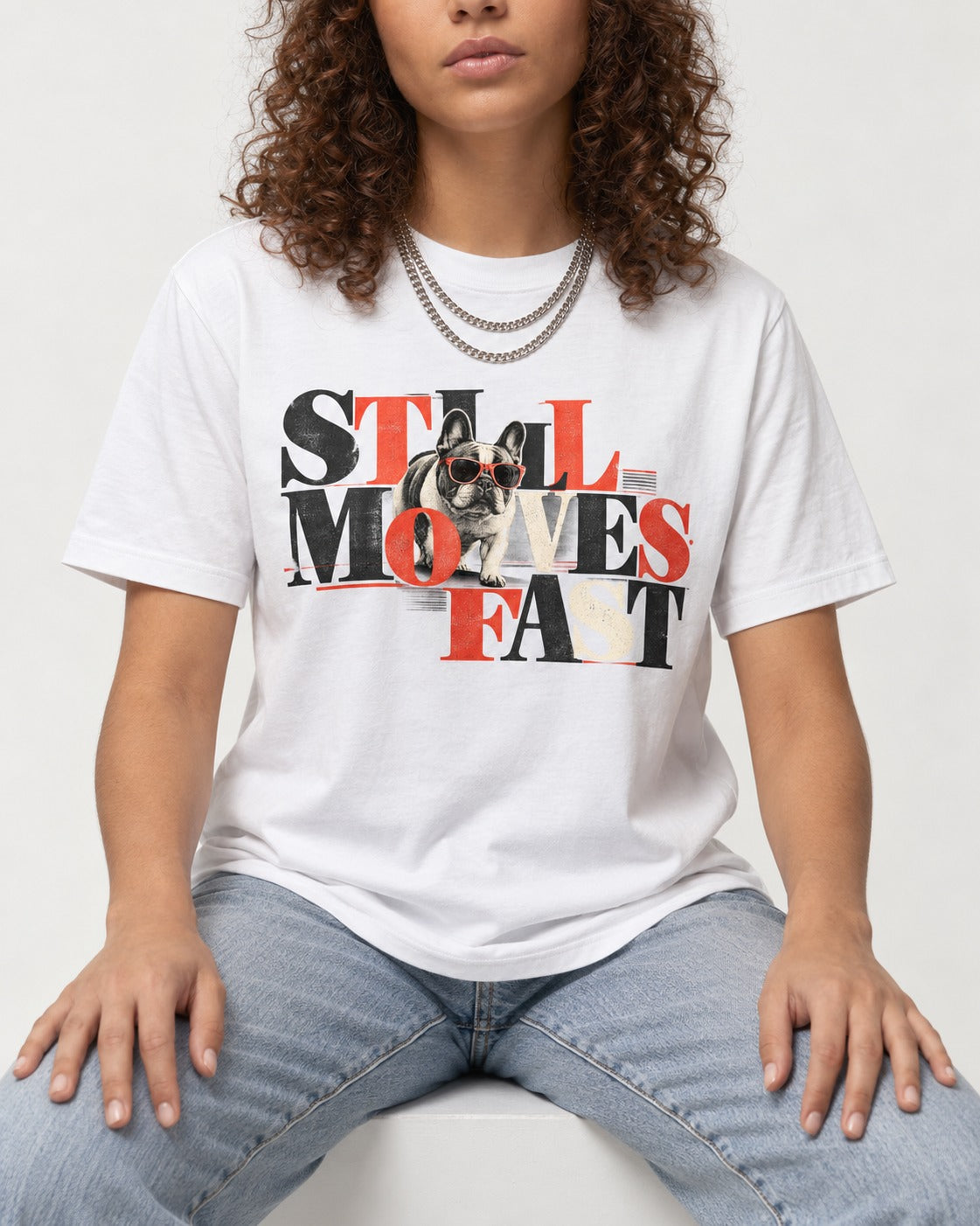 Frenchie Still Moves Fast T-Shirt in White, worn by a seated model