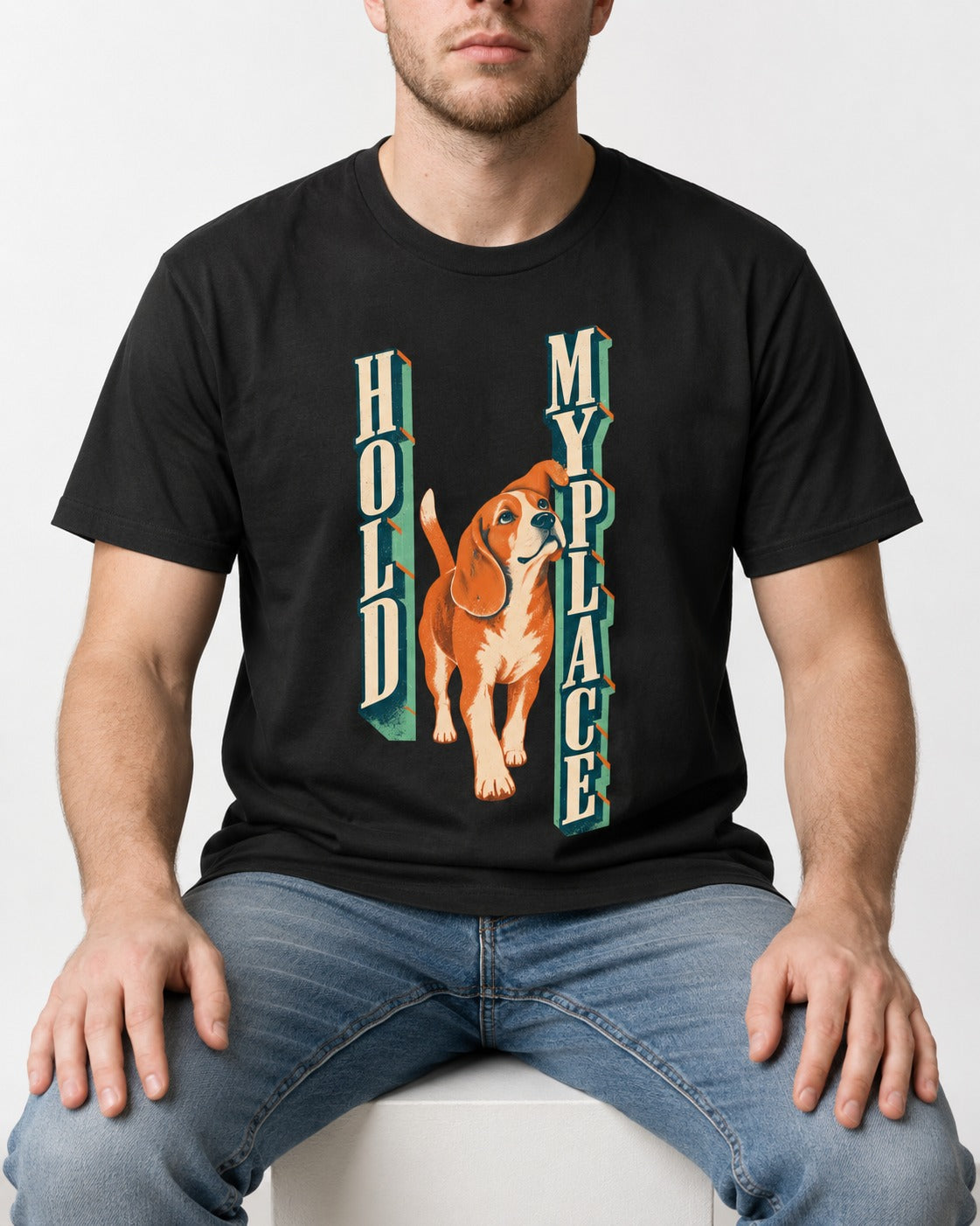 Vintage Beagle Hold My Place T-Shirt in Black, worn by a seated model