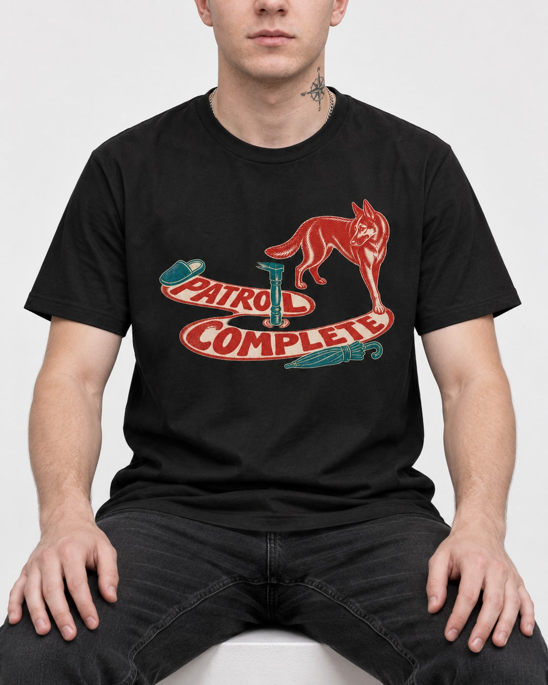 German Shepherd Dog Patrol Complete Umbrella Graphic T-Shirt in Black, worn by a seated model